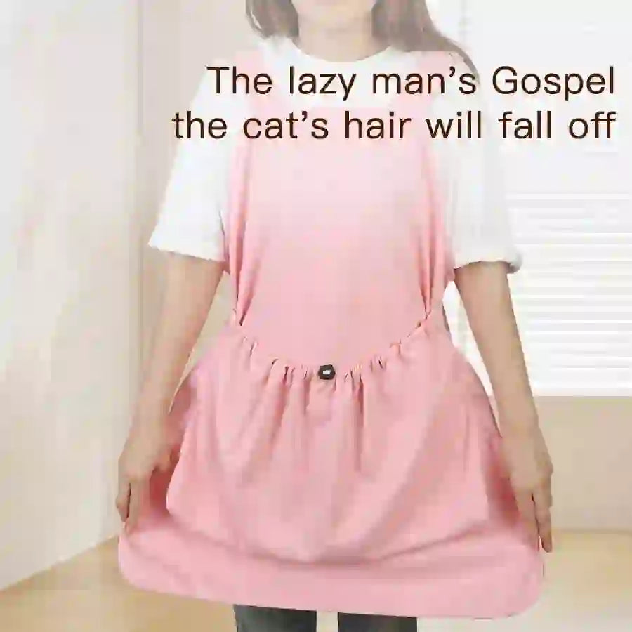 Pink grooming apron for cats and pets made of lightweight material, designed to protect clothes during grooming and bathing