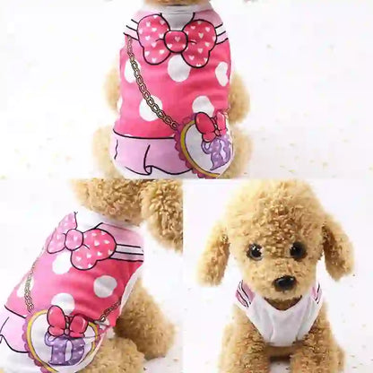 Cute beige puppy wearing a pink cartoon vest with white polka dots, large pink bow, and a small purse graphic, suitable for spring and summer.
