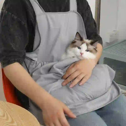 Person wearing a light gray grooming apron holding a fluffy Ragdoll cat with blue eyes, designed to protect clothes during pet grooming, SKU: 14:1052#Pink