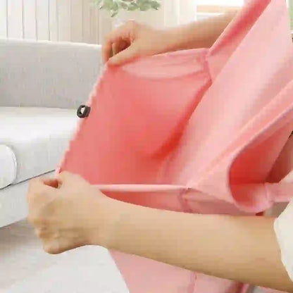Pink non-shedding grooming apron for cats and pets, made of lightweight waterproof material, with adjustable strap for pet grooming and bathing.