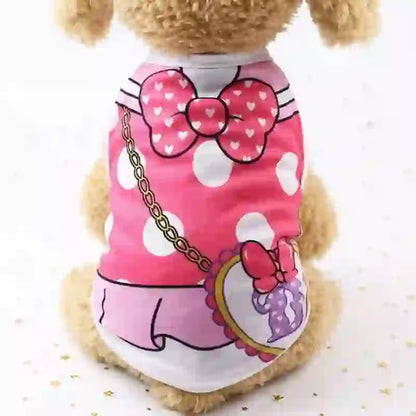 Cute plush dog wearing a pink cartoon vest with white polka dots, bow detail, and a small purse accessory, designed for pet comfort and style